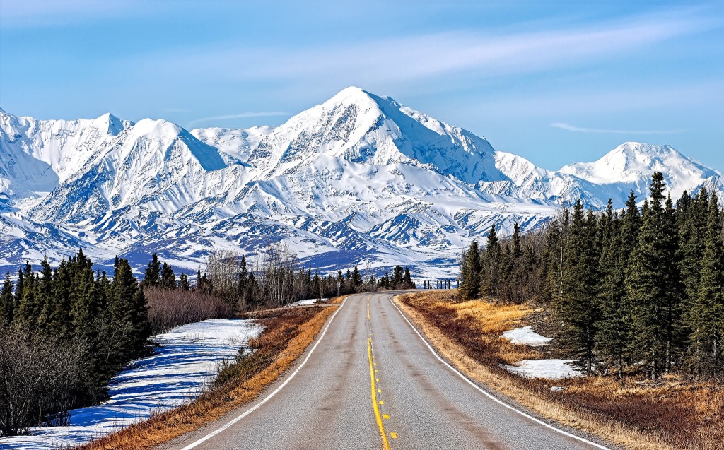on the Alaska Highway leading to a snowy mountain